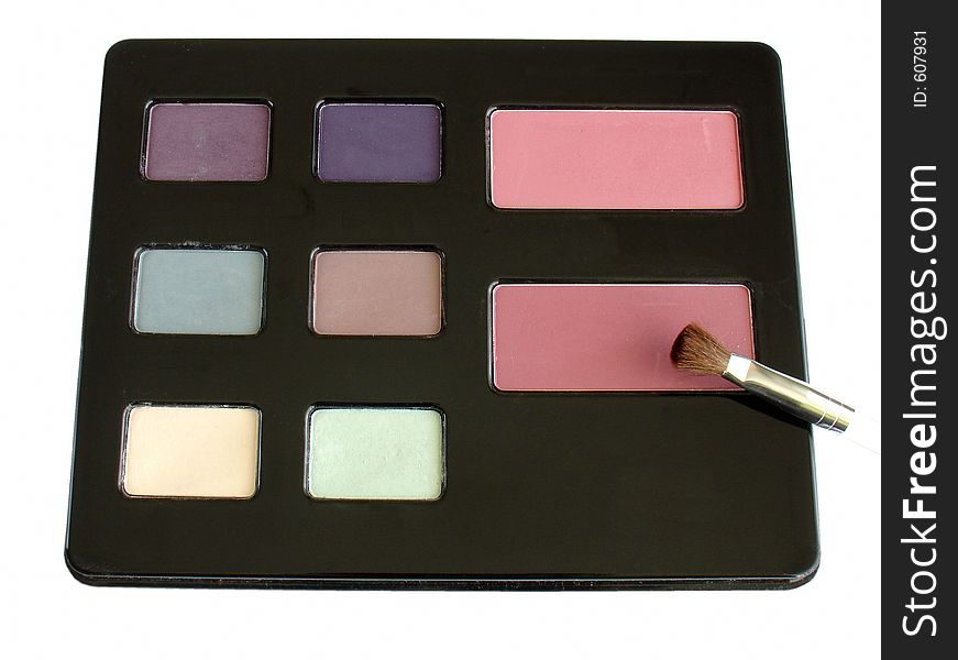 A palette of colored eyeshadows and blushes