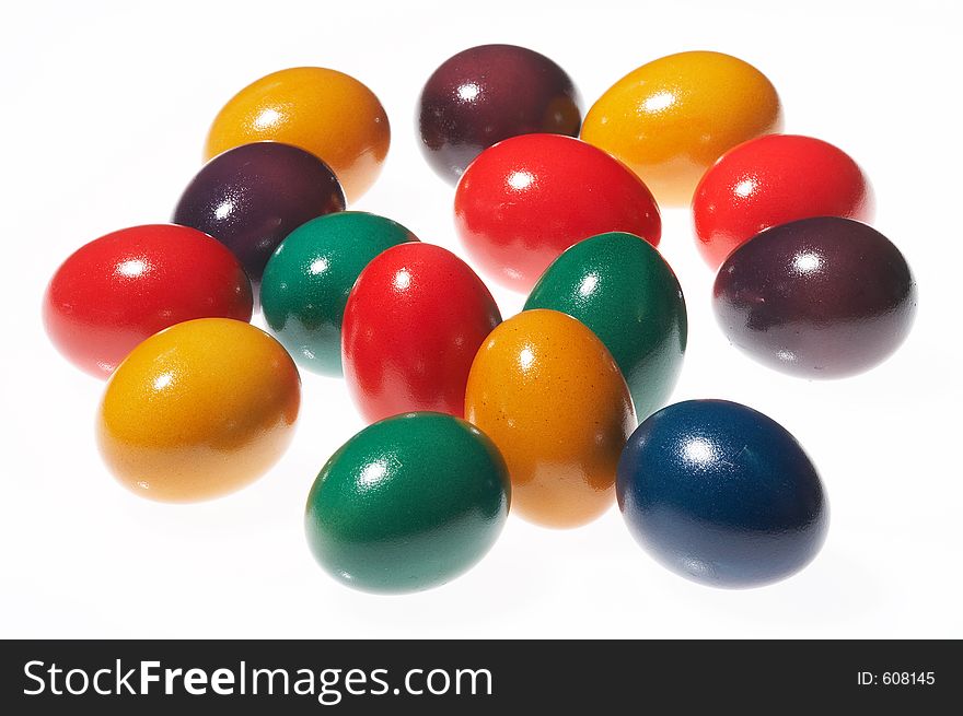 Many coloured eggs on white background. Many coloured eggs on white background