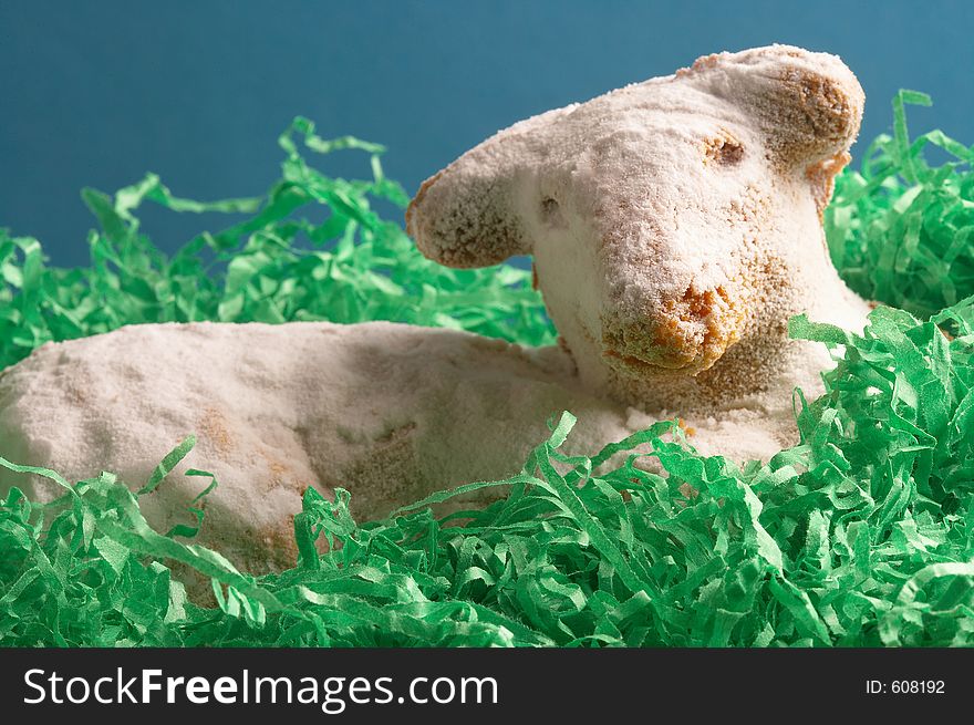 Easter lamb laying in a easter basket. Easter lamb laying in a easter basket