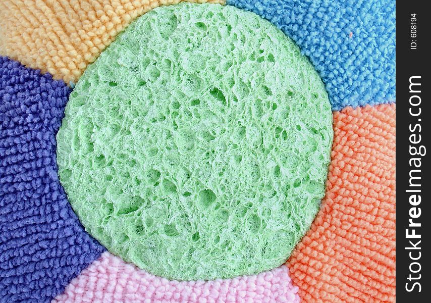 Colored flower shaped sponge closeup. Colored flower shaped sponge closeup