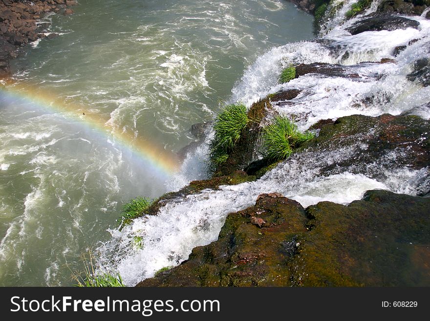 Waterfalls at Iguacu, Brazil/Argentina with beautiful rainbow. Waterfalls at Iguacu, Brazil/Argentina with beautiful rainbow.