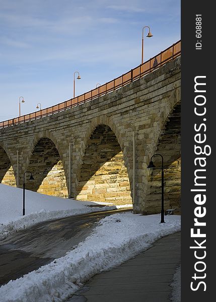 Road traveling under the Stone Arch Bridge in Minneapolis, Minnesota