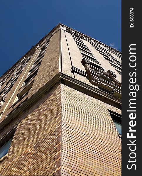 Corner of the building against a blue sky.