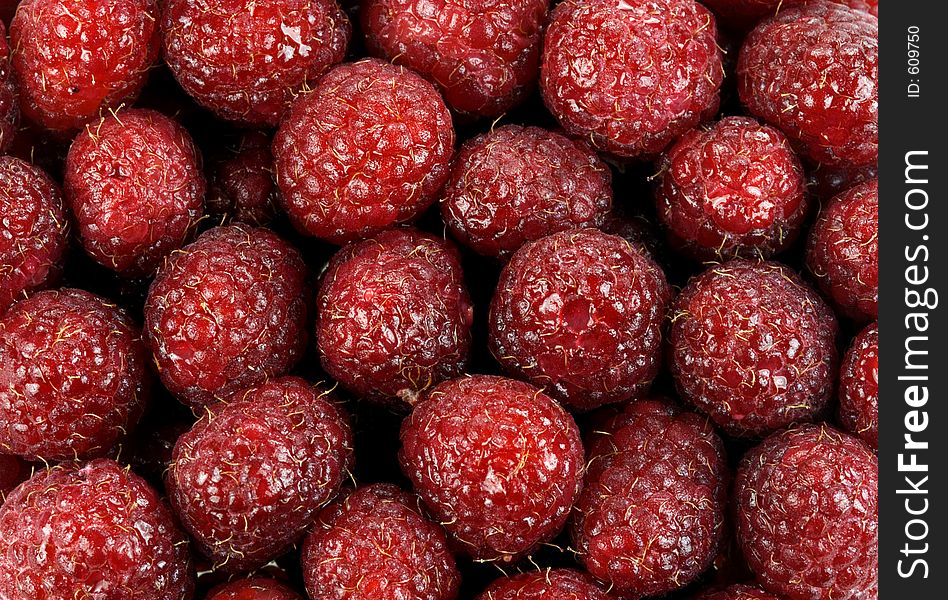 Pile of red luscious raspberries