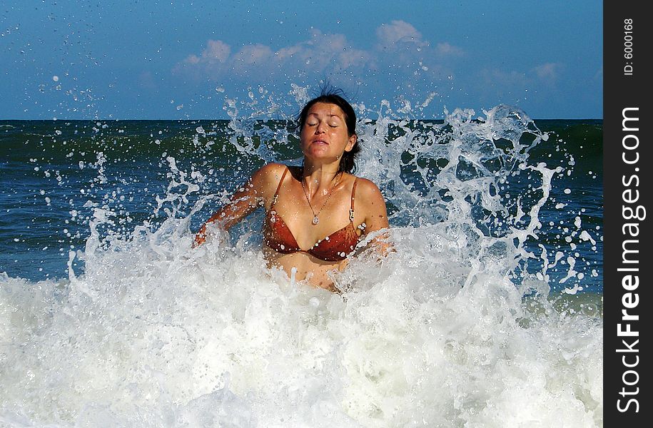 The girl was hit by the wave on Cape Canaveral town beach (Florida). The girl was hit by the wave on Cape Canaveral town beach (Florida).