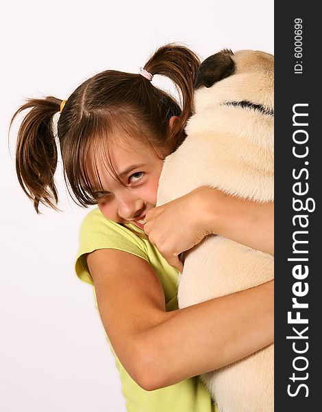 Lively smiling girl holding pup. Lively smiling girl holding pup