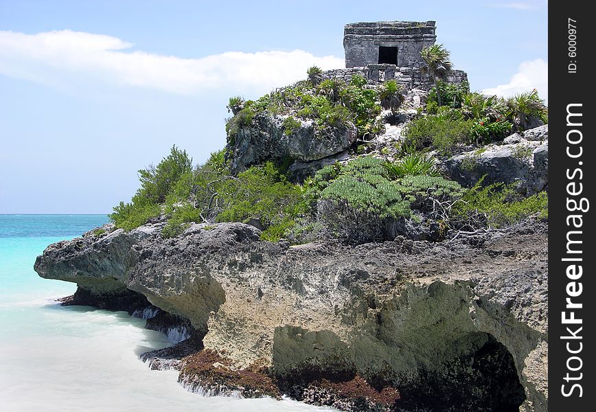 The rocky coast of Tulum Mayan city that was the only one built on a shore of the Caribbean Sea (Mexico). The rocky coast of Tulum Mayan city that was the only one built on a shore of the Caribbean Sea (Mexico).
