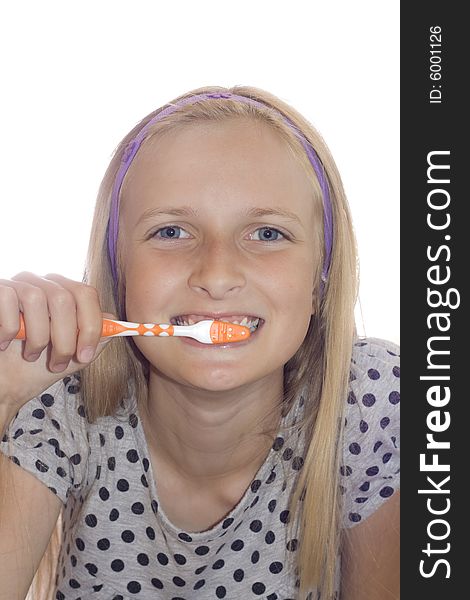 Young teenager girl cleaning tooth with toothbrush
