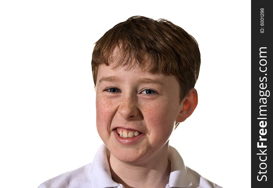 Portrait of a young boy smirking.