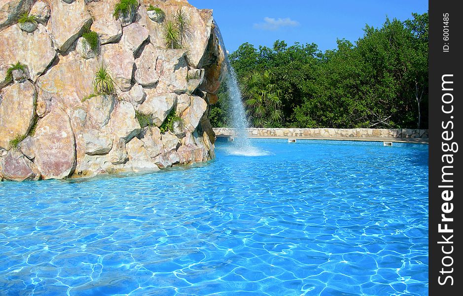Carribean resort with pool waterfall