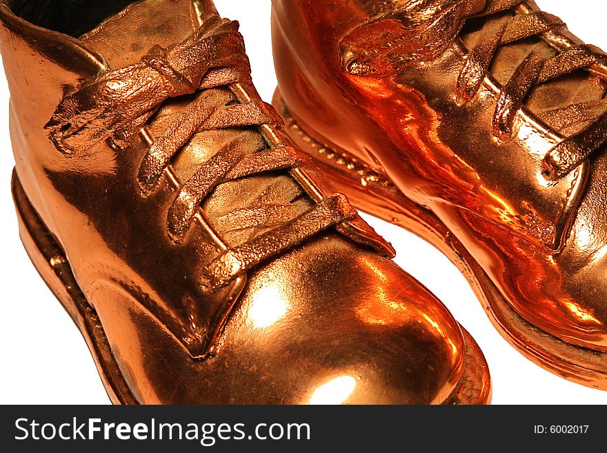 Close up of bronzed baby shoes