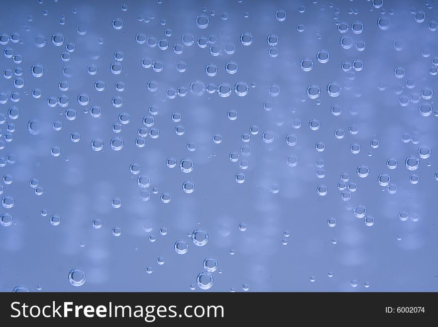 Drops of water on a blue background. Drops of water on a blue background