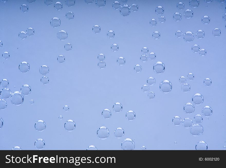 Drops of water on a blue background. Drops of water on a blue background