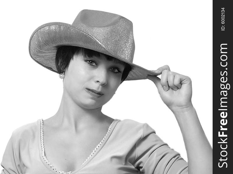 The beautiful girl in a green cowboy's hat. Isolated. Grayscale. The beautiful girl in a green cowboy's hat. Isolated. Grayscale