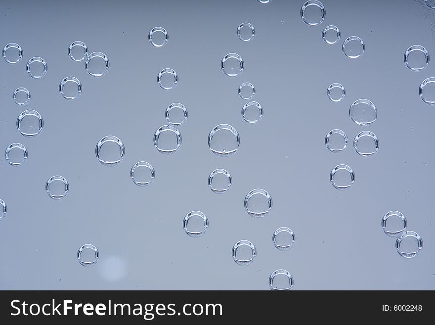 Drops of water on a blue background. Drops of water on a blue background