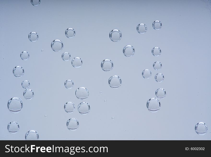 Drops of water on a blue background. Drops of water on a blue background