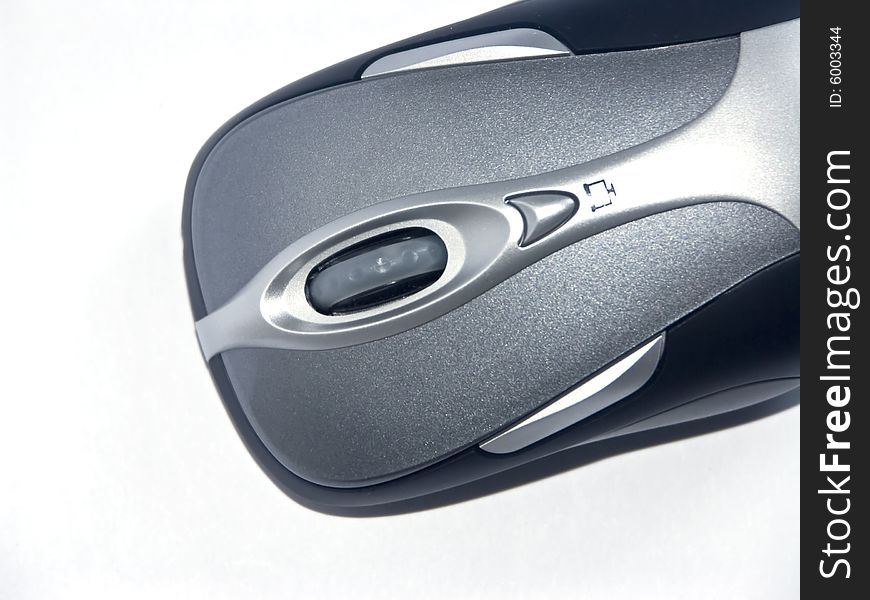 The image of the computer mouse on a homogeneous background. The image of the computer mouse on a homogeneous background