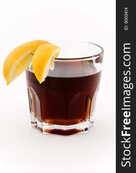 Cocktail with cola lemon on white. Cocktail with cola lemon on white