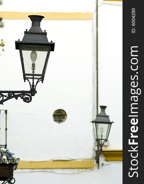 Typical street decorated with lamppost  in Sevilla. Typical street decorated with lamppost  in Sevilla