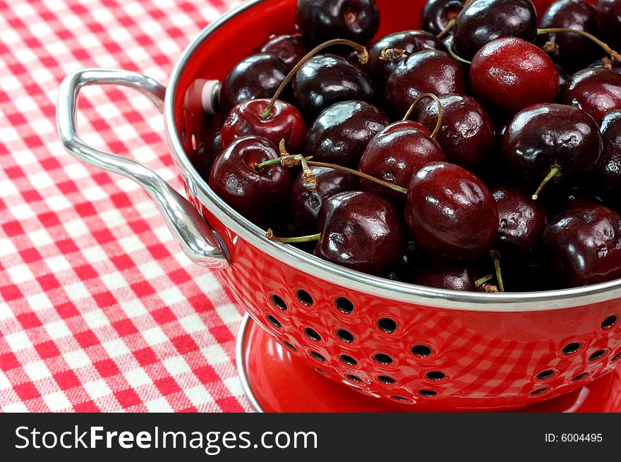 A full colander of fresh ripe bing cherries. A full colander of fresh ripe bing cherries.