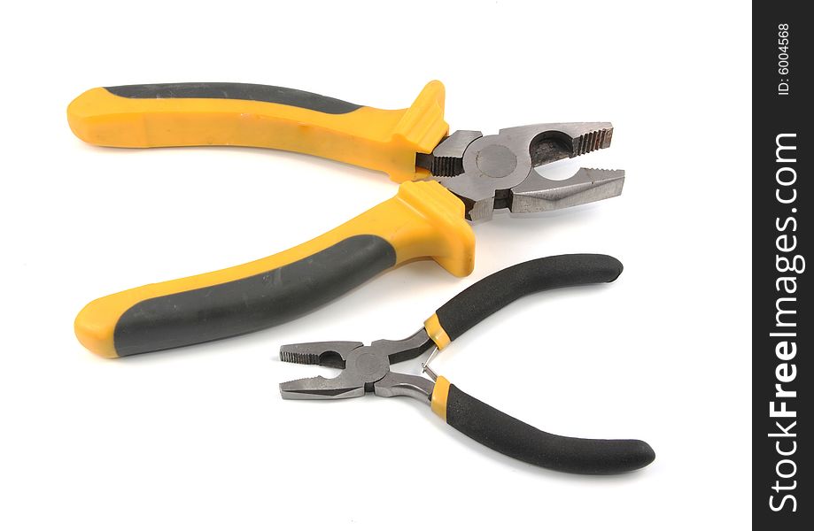 The big and small flat-nose pliers lay on a white background.