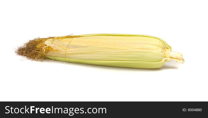 Unpacked crunchy Fresh Sweetcorn on white ground