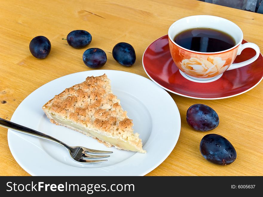 Slice of apple cake with coffee.