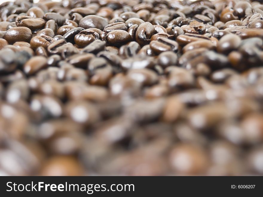 Closeup shot of coffee beans filling frame; selective focus
