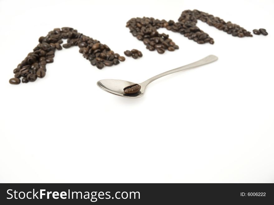 A.M. for morning, made from coffee beans; focus is on teaspoon with a bean