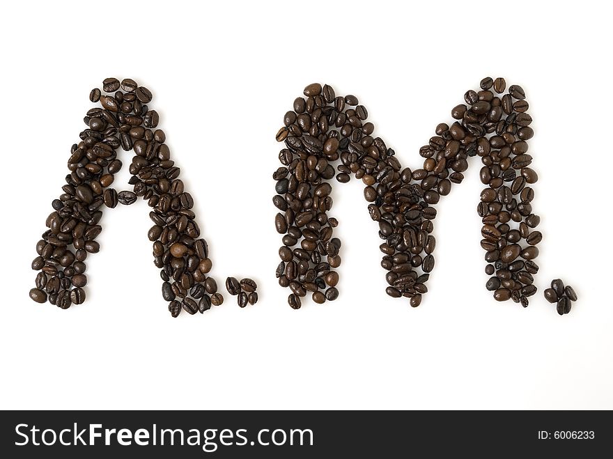 A.M. for morning written with coffee beans; shot against white background