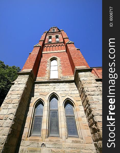 Historic church complex against blue sky background