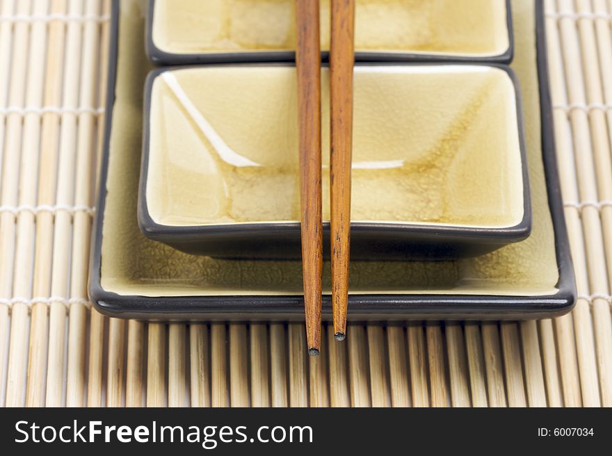 Abstract Chopsticks and Bowls with Narrow Depth of Field.