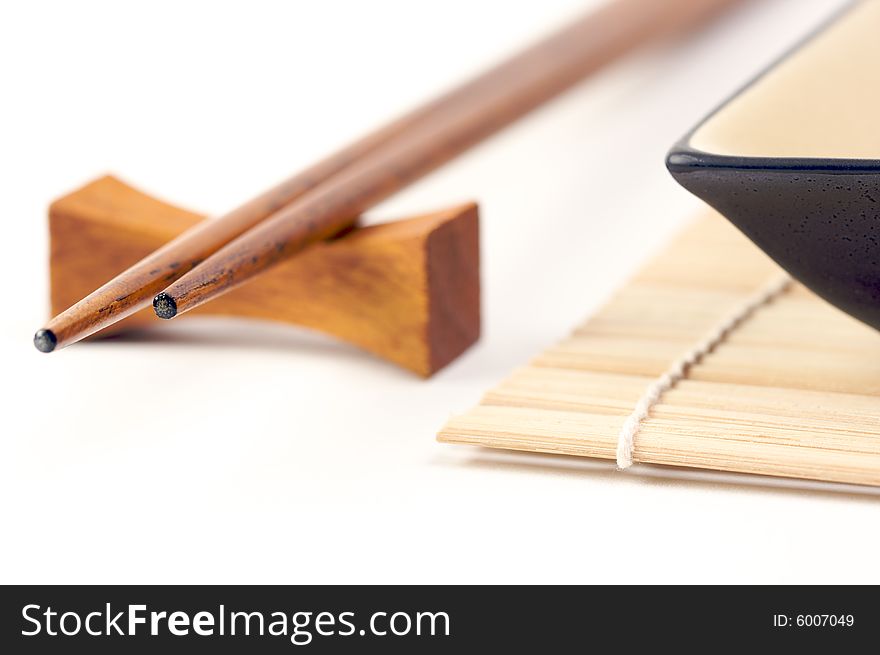 Abstract Chopsticks and Bowls Isolated on a White Background.