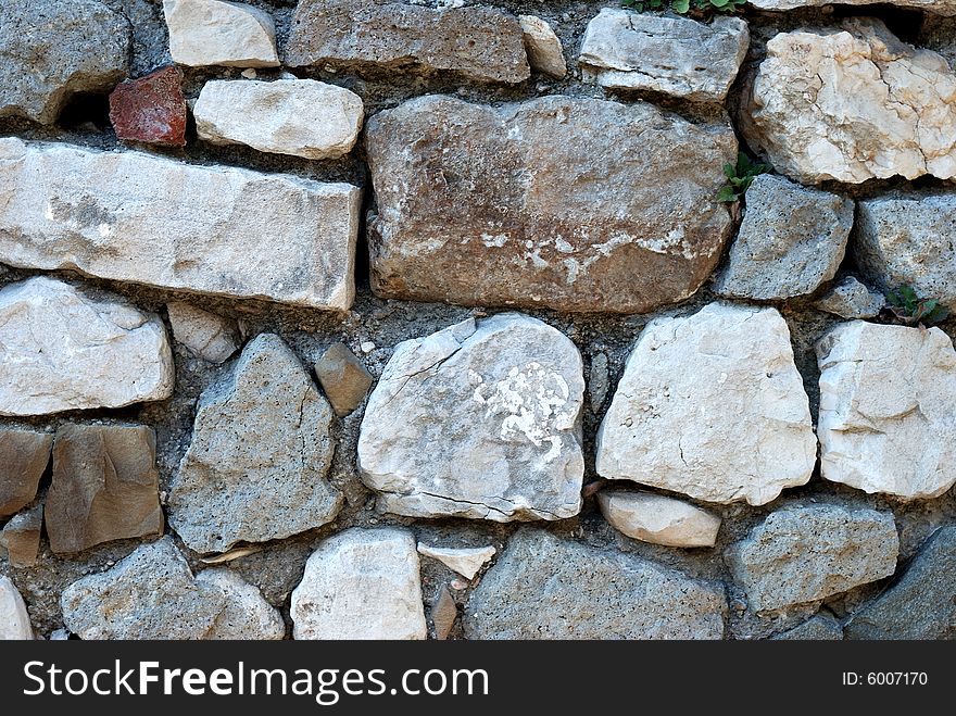 Stone wall made from big stones and rocks