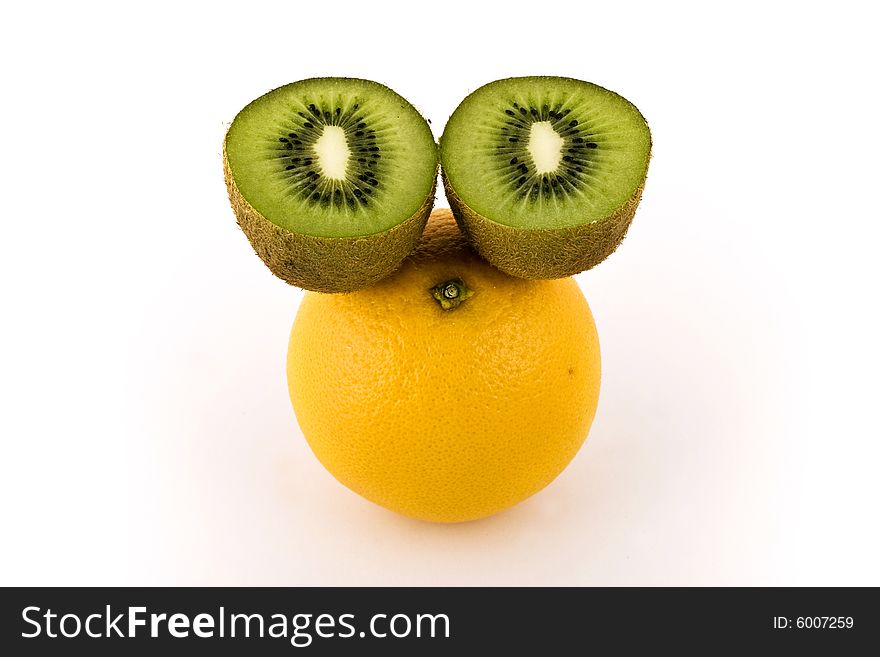 Lemon and two halves of cut apart kiwi on white. Lemon and two halves of cut apart kiwi on white