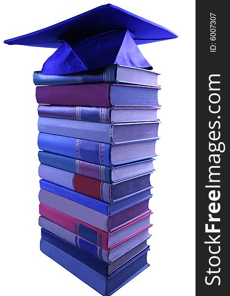 Blue Graduation cap on top of book pile