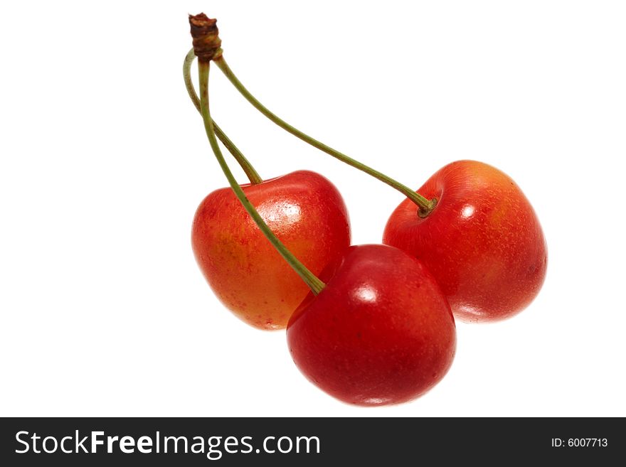 Three cherries isolated on white background