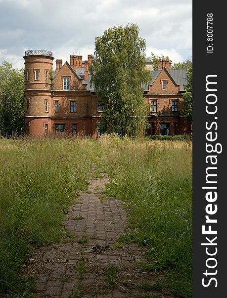 Abandoned old castle, ruins, footpath, green grass