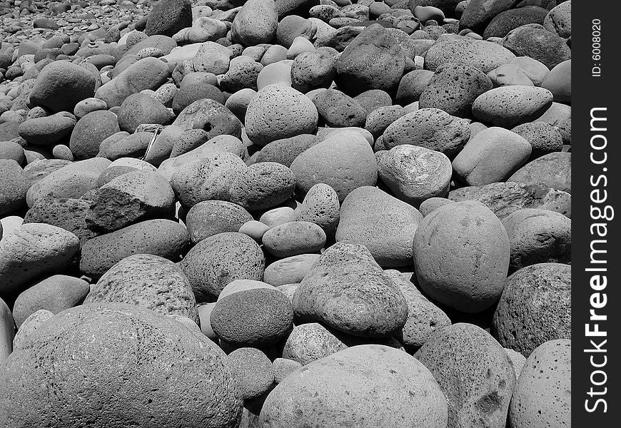 Round stones covering ground in black and white. Round stones covering ground in black and white