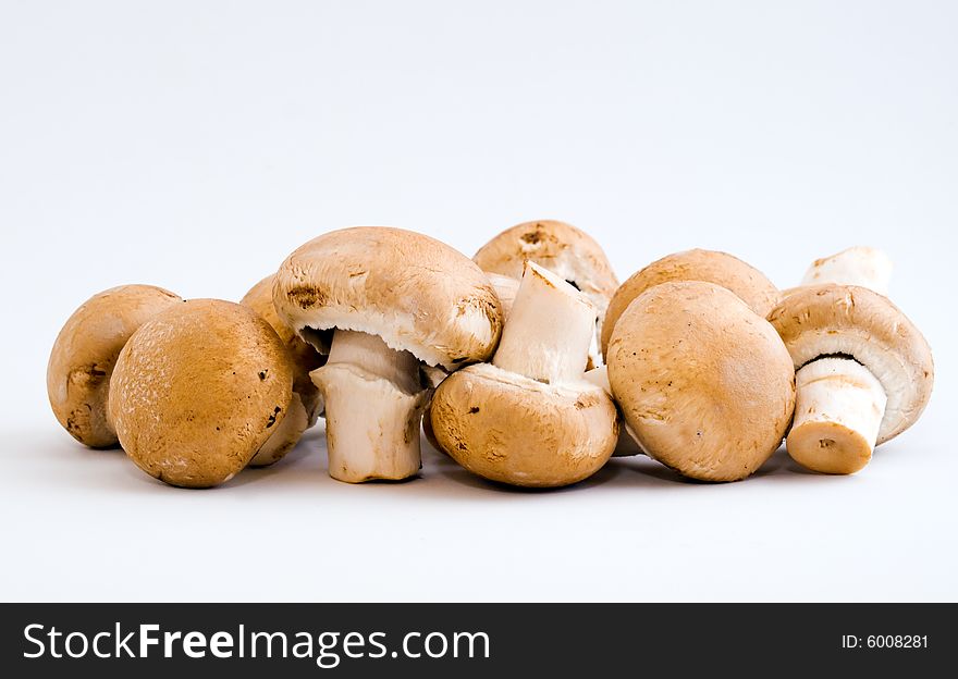 Still life of a handful of swiss brown button mushrooms