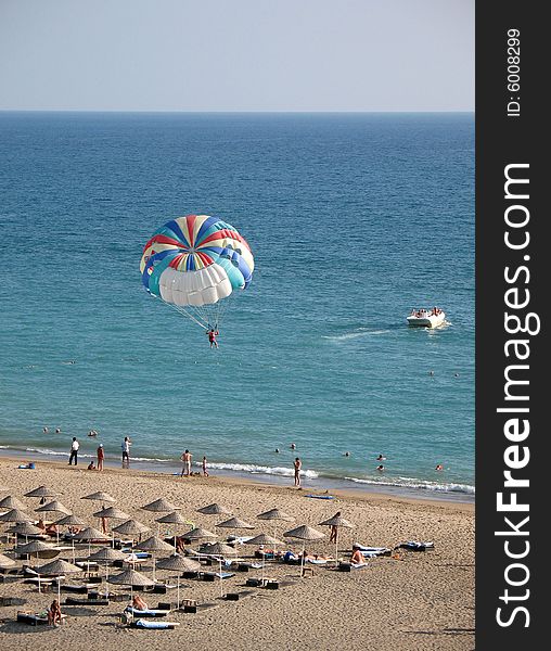 Flying with parachute above the sea. Flying with parachute above the sea