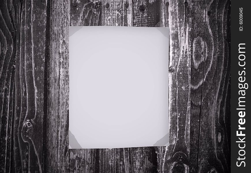 Blank paper on old wooden background
