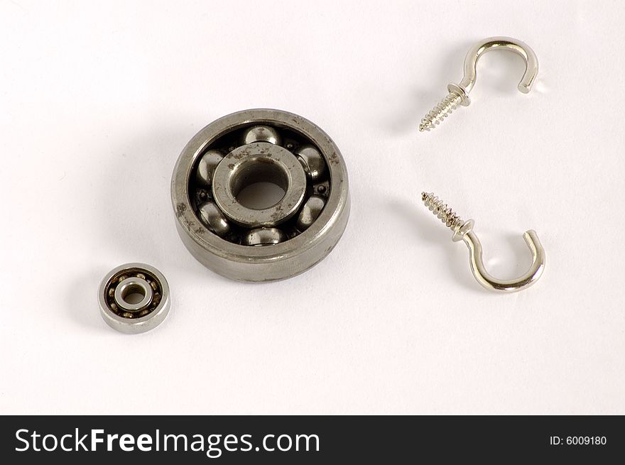 Still life with old bearing & hook on white background. Still life with old bearing & hook on white background.