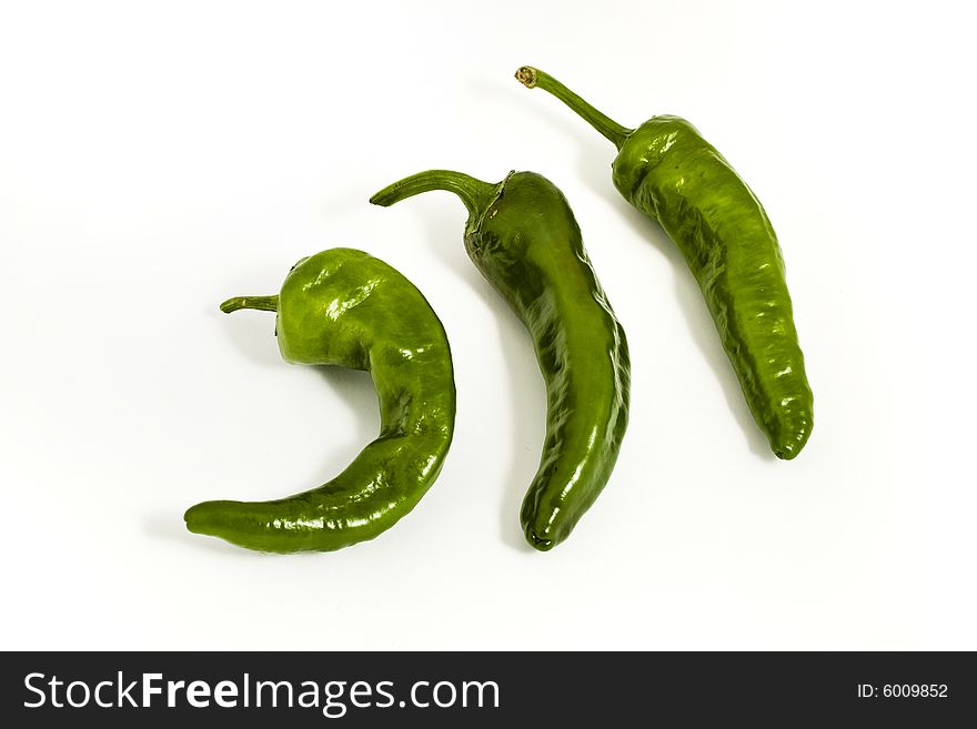 Three green peppers isolated on white background. Three green peppers isolated on white background
