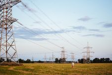 Power Lines Field, Lonely Man Walking Royalty Free Stock Images Power Lines Field, Lonely Man Walking Royalty Free Stock Images