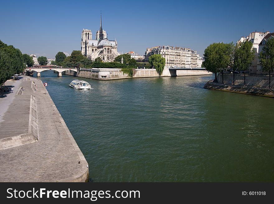 Riverside embankment on the river Seine in Paris on a summers day. Riverside embankment on the river Seine in Paris on a summers day.