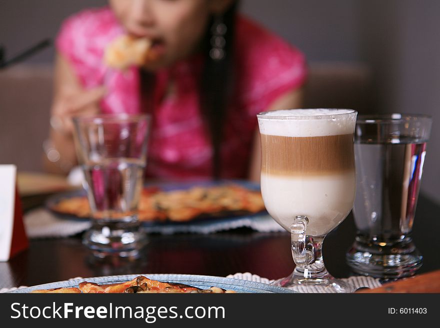 Coffee and girl in restaurant