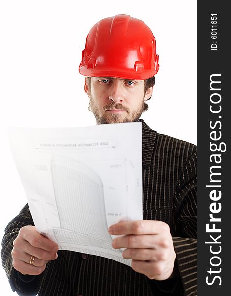 Construction foreman in red helmet checking drawings
