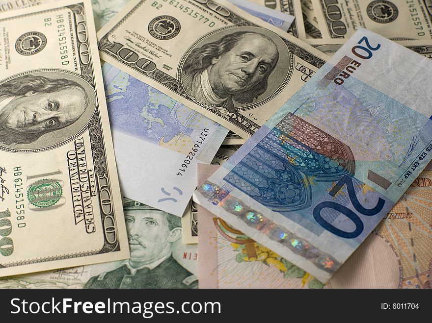 The Euro, dollars and pesos banknotes background. The Euro, dollars and pesos banknotes background