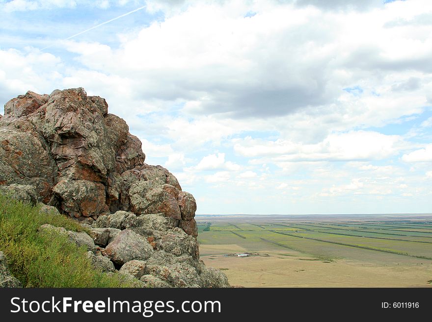 Close up of rock on background of beautiful landscape. Close up of rock on background of beautiful landscape